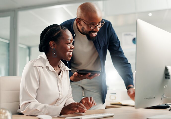 Two colleagues reviewing connected municipal operations on screen